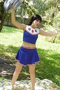Take A Look At This Excited Cheerleader As She Undressed In The Public And Rubs Her Clit In This Porn