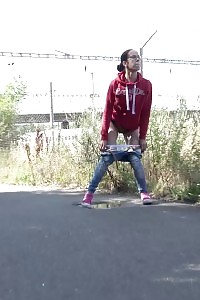 European In Glasses Squats To Pee By Railway