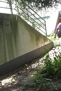 Black Haired Showstopper In Skirt Pissing Outside