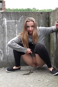 Magnificent Brunette Pisses In The Middle Of The City
