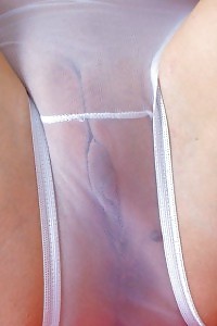 Sexy Brunette Kelly Dee Strips On The Couch Having Fun With Her Sheer Panties