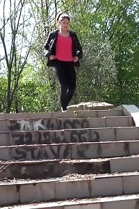 Black-haired Doll Pisses Down Some Concrete Steps