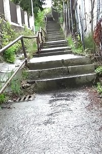 Blonde Honey Pissing On The Bottom Of Some Steps