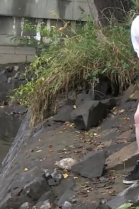 Brunette Bitch Pisses Next To A Flowing River